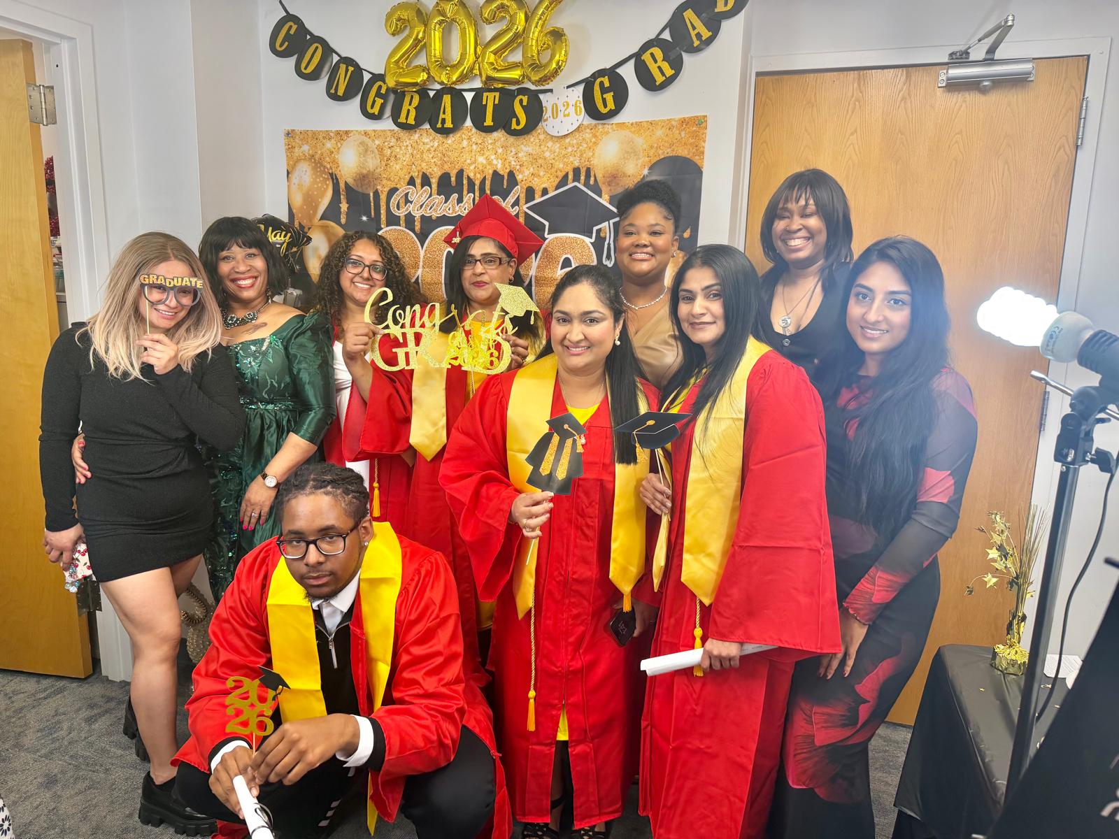 1st Cohort Graduation, dressed in red