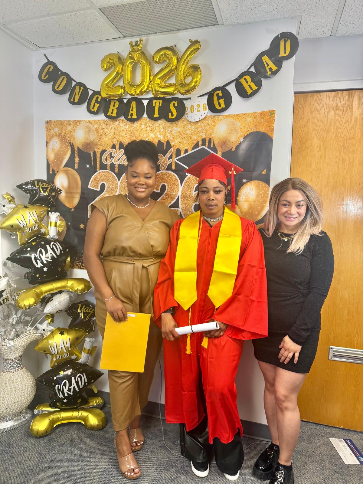 1st Cohort Graduation, dressed in red